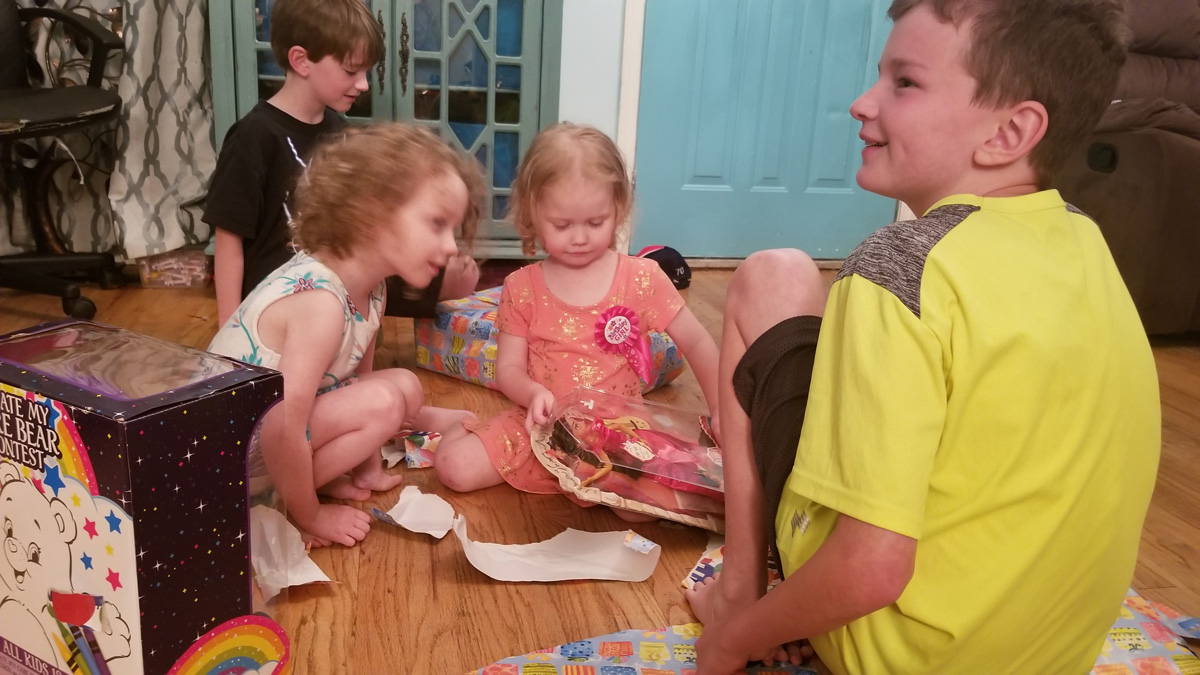 The fun of opening birthday presents The fun of opening birthday presents