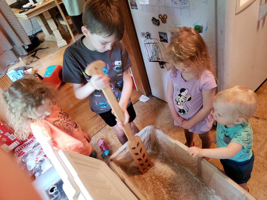 kids stirring the mash