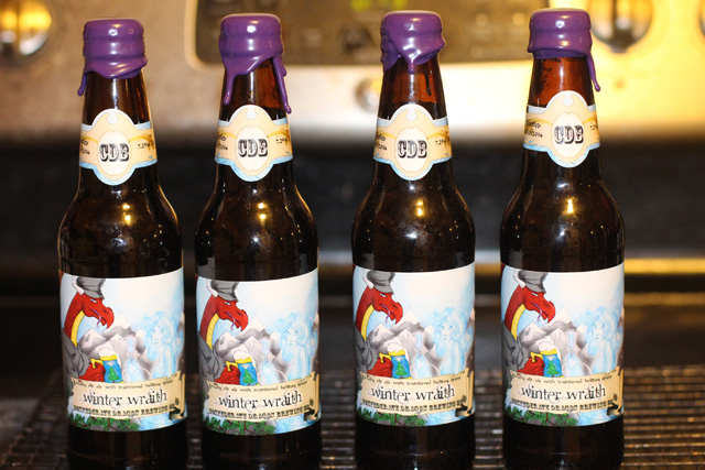 Holiday beer bottles, labeled and waxed Holiday beer bottles, labeled and waxed